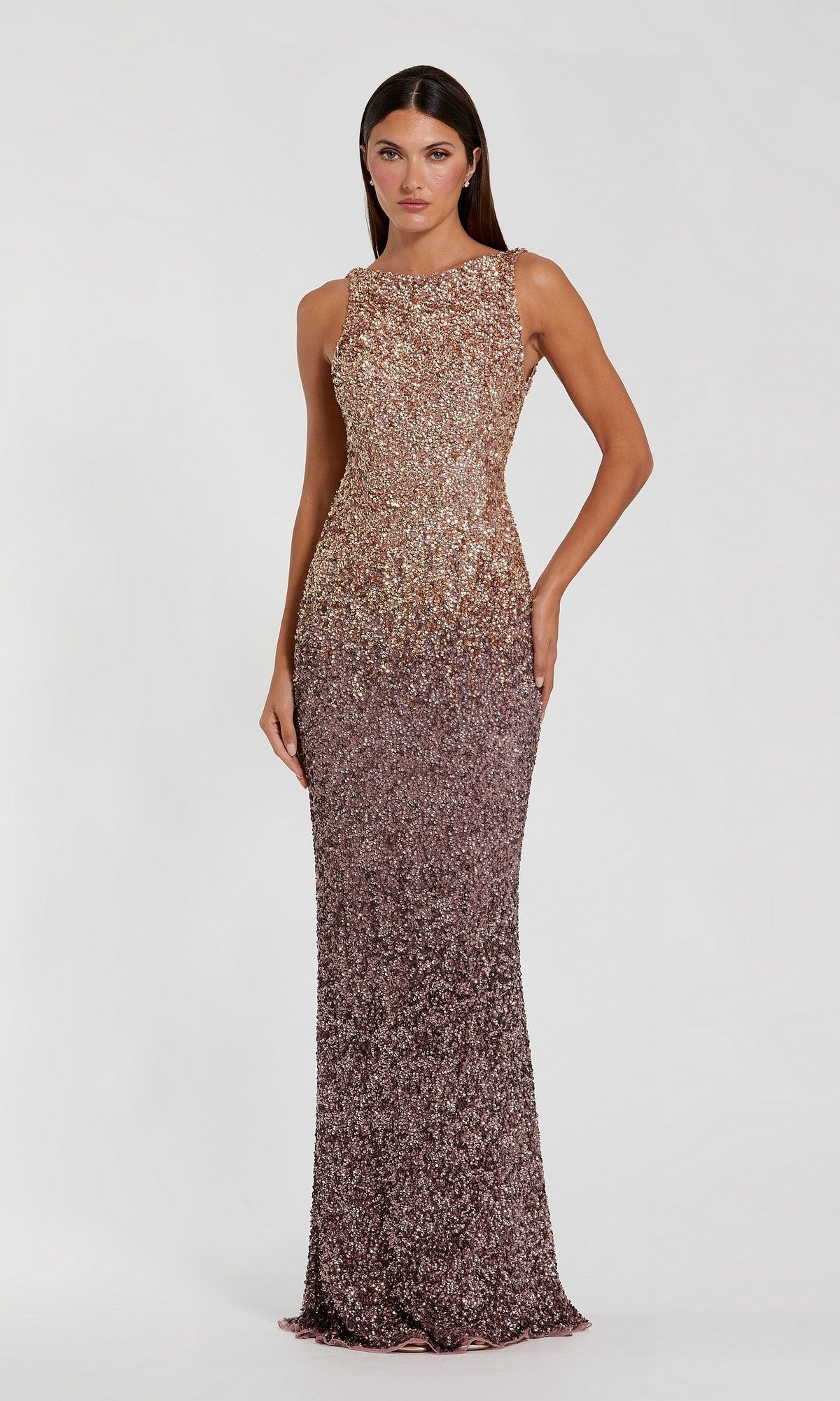 A woman poses against a plain background in the Long Formal Dress: Mac Duggal 6145, a sleeveless, floor-length sequin gown in Gold Amethyst with an open cowl back.