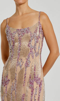 A person wearing the Mac Duggal 6150 Long Formal Dress, a sleeveless nude mesh dress embellished with silver and pink sequins, shown from shoulders to mid-thigh.