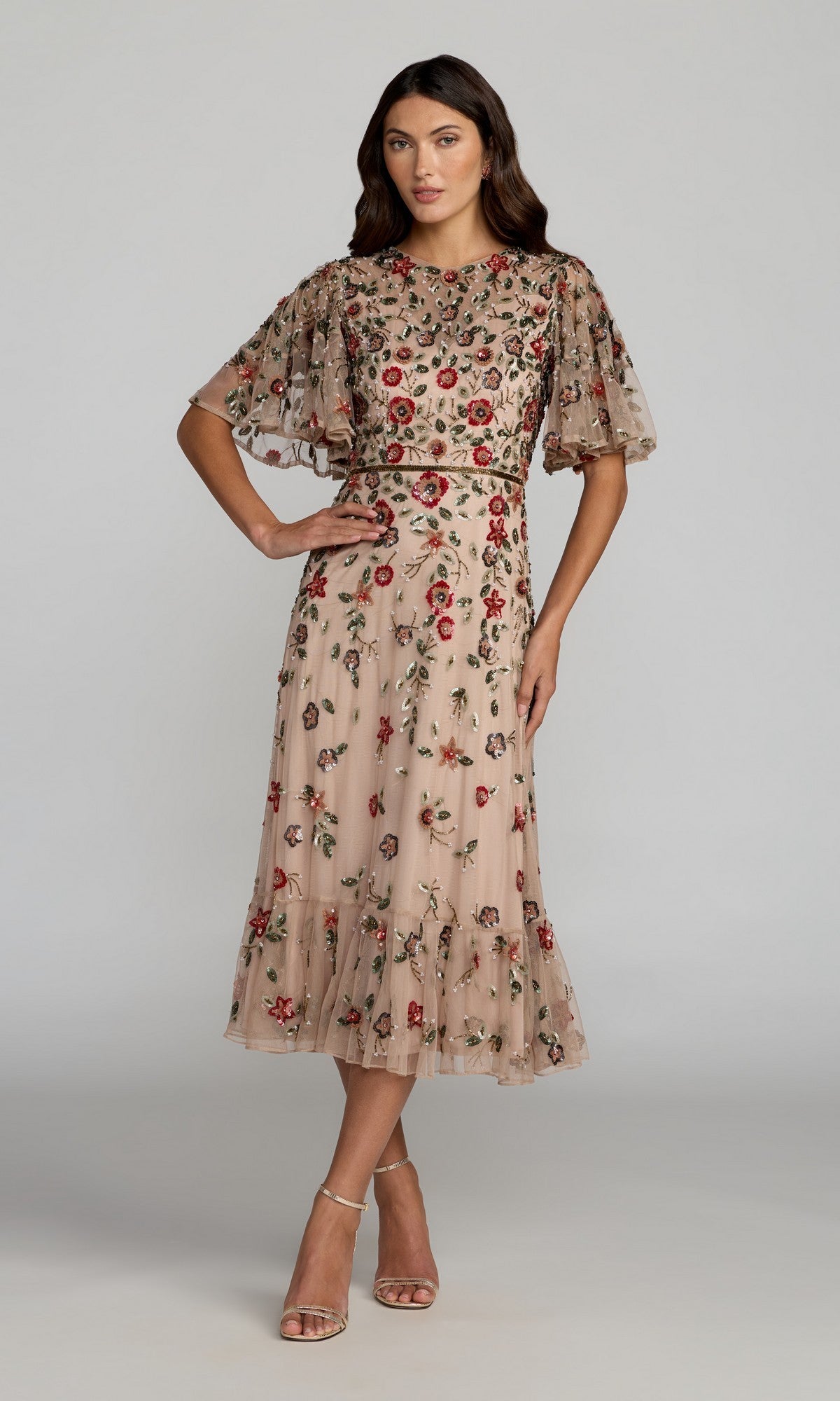 Woman wearing the Mac Duggal 6162 Green Midi Wedding Guest Dress in Antique Rose, featuring delicate embroidery and short flutter sleeves, stands with one hand on her hip against a plain background.