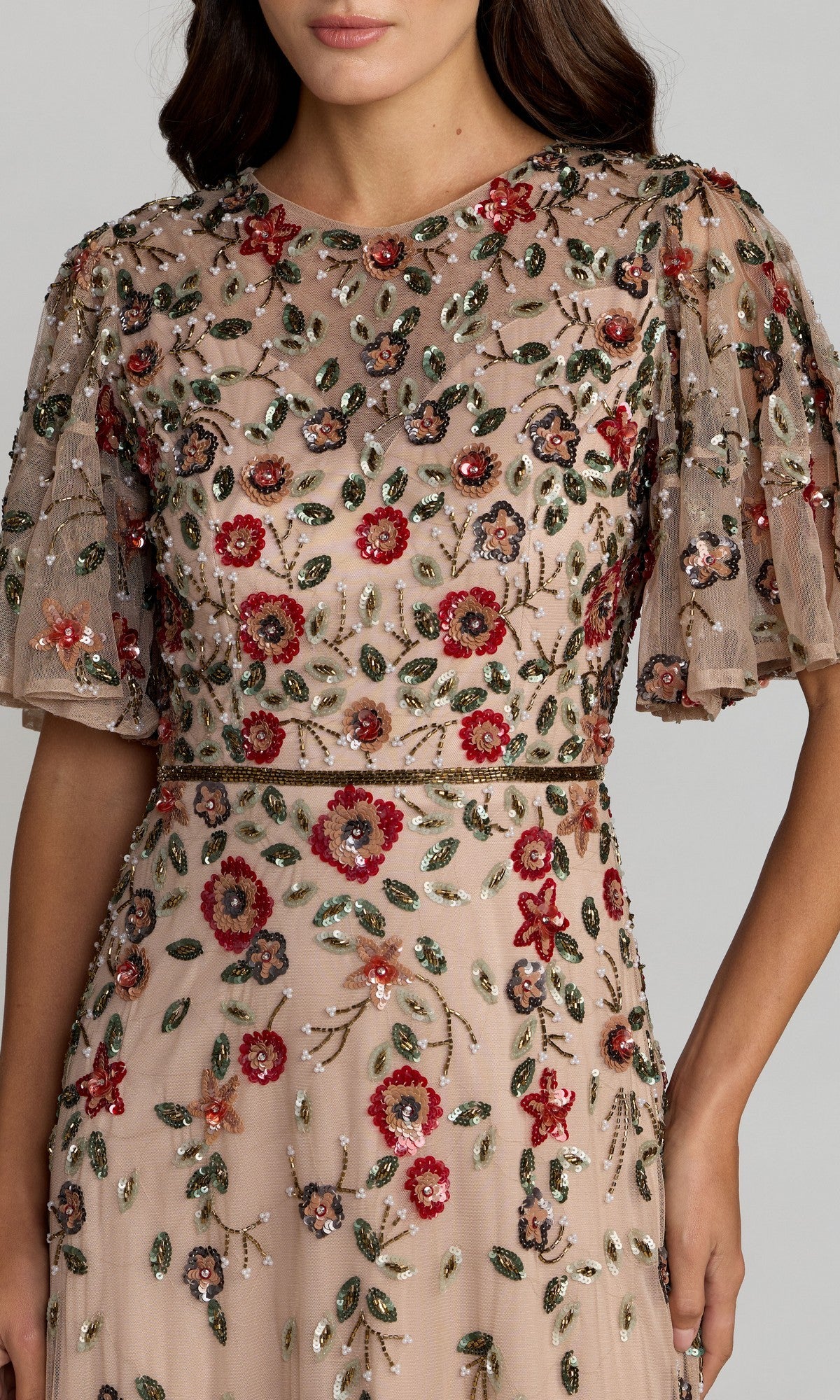 Woman wearing the Mac Duggal 6162 Green Midi Wedding Guest Dress, featuring sheer flutter sleeves and embellished with red, green, and silver floral embroidery and beading.