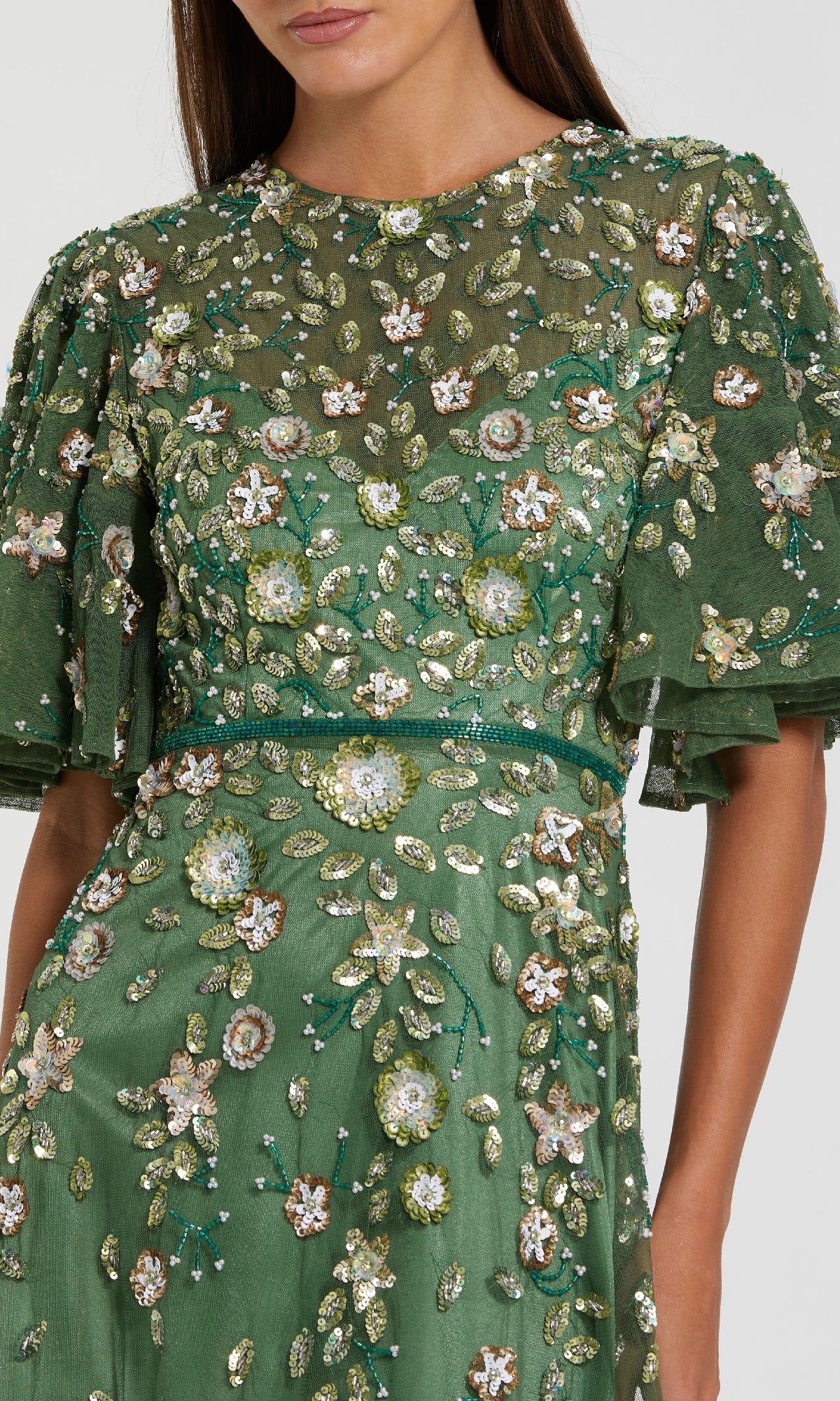 Green dress with floral embroidery on a white background