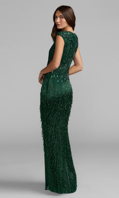 A woman stands turned to the side against a plain gray background, wearing the Mac Duggal 6169 Beaded Long Formal Dress in dark green.