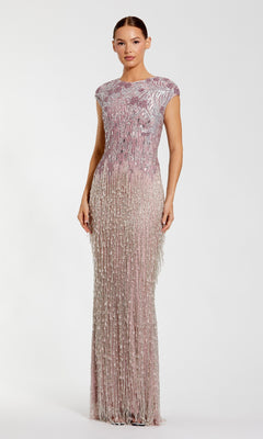 A woman poses against a plain white background wearing the Beaded Long Lilac Formal Dress: Mac Duggal 6169, a floor-length gown with silver beaded embellishments and fringe detailing.