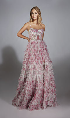 A woman wearing the Alyce 61732 long prom dress—sleeveless, floor-length, with a ruffle a-line skirt and sheer corset bodice adorned with floral patterns—stands against a plain gray background.