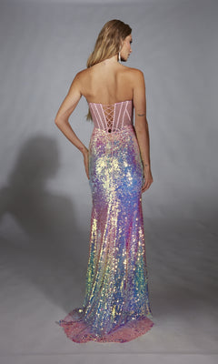 A woman faces away from the camera in the Alyce 61734 long prom dress, a strapless gown adorned with iridescent pink, purple, blue, and yellow sequins.