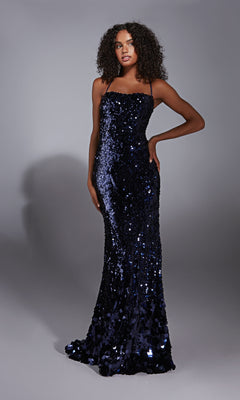 A woman poses against a plain gray background in the Alyce 61758 Strappy-Back Long Sequin Prom Dress, featuring thin straps and a fitted, floor-length silhouette.