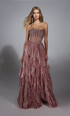 A woman poses against a gray background wearing the Strapless Long Glitter A-Prom Dress: Alyce 61762, a pink, ruffled evening gown.