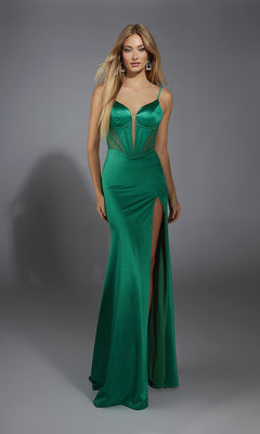 A woman in a green Lace-Up Long Corset Prom Dress (Alyce 61791) with a high slit and mesh detailing poses against a plain gray background.