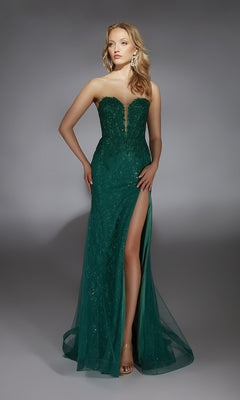 A woman wears the Alyce 61793 Long Prom Dress—a strapless, dark green, floor-length gown with a corset bodice, sequin details, and a thigh-high slit—standing against a plain gray background.