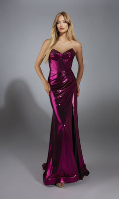 A woman poses in the Alyce 61798 Strapless Metallic Long Prom Dress, featuring a shiny magenta finish, ruched bodice, and floor-length skirt, against a neutral gray background.