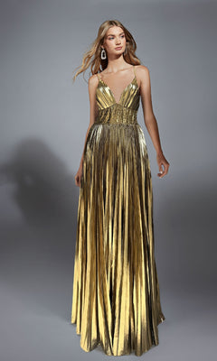 A woman wears the Alyce 61804 long prom dress with a metallic foil finish, featuring a pleated A-line skirt, thin straps, and a fitted bodice, set against a plain gray background.