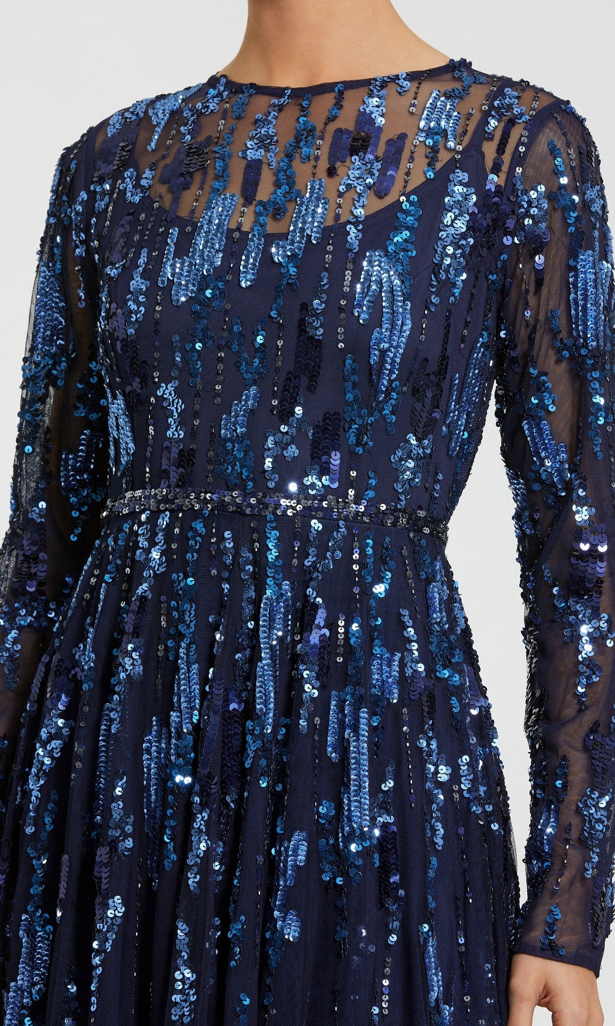 Wearing the Mac Duggal 6181 long formal dress, which features a navy blue sequin design with sheer sleeves and striking geometric sequin patterns, this look focuses on the torso and upper legs—creating the perfect impression for an elegant evening gown.