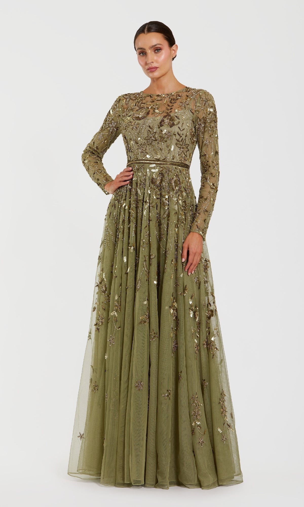 Green evening gown with intricate detailing on a white background
