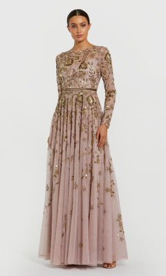 Woman wearing a long, embroidered dress on a white background