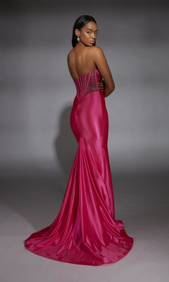 A woman poses with her back to the camera against a gray background, wearing the Alyce 61851: a strapless, fitted hot pink long corset prom dress with a flared train.