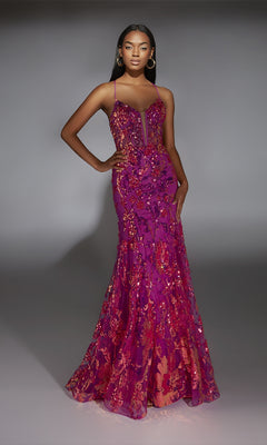 A woman poses confidently in a studio, wearing the Alyce 61854 Long Prom Dress—a magenta sequin gown with thin straps and a flared mermaid hem.