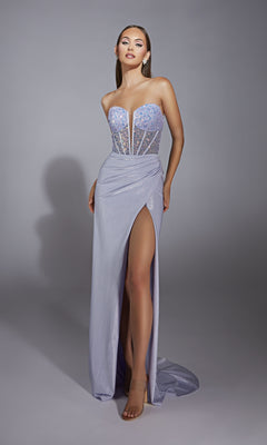 A woman models the Alyce 61856 long prom dress, a strapless metallic gown with an embellished corset bodice, high slit, and structured sequined details, posed against a plain gray background.
