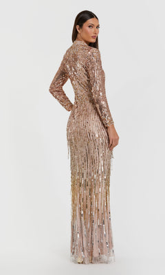 Woman wearing a sparkly gold dress on a white background