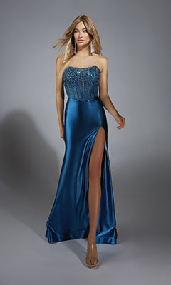 A woman wears the Alyce 61879 strapless long satin prom dress, featuring a beaded corset bodice and high slit, standing against a gray background.