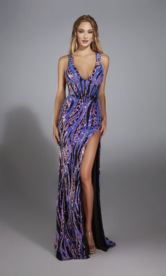 A woman models the Alyce 61897 long prom dress, a sleeveless sequin gown with a deep neckline, corset lace-up back, purple and black pattern, high slit, and floor-length hem against a plain gray background.