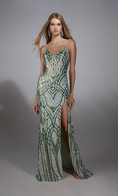 A woman in the Alyce 61920 long prom dress—sleeveless, floor-length, with geometric sequin patterns, a high slit, and lace-up back—stands against a plain gray background.