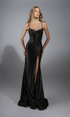 A woman wears the Alyce 61950 Lace-Up Long Corset Prom Dress, featuring spaghetti straps, a sheer bodice detail, and a high leg slit, standing against a plain gray background.