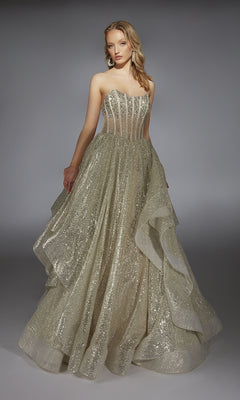 A woman in the Alyce 61971 long prom dress, featuring a beaded corset bodice and layered ruffled skirt, stands against a plain gray background.