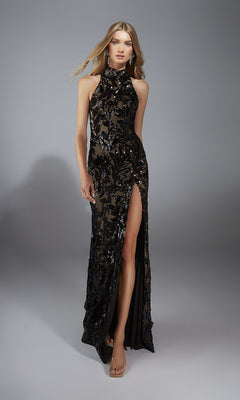 A woman poses against a plain gray background wearing the Alyce 61979 long prom dress, featuring a sleeveless, high-neck design with a high slit and shimmering sequin details.