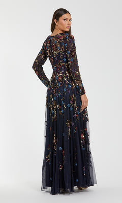 Woman wearing a long, dark floral dress on a white background