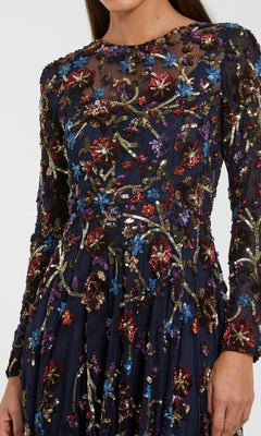 Navy blue dress with colorful floral embroidery on a white background