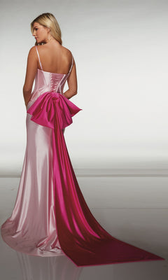 A woman wearing the Alyce 61983 long prom dress, featuring a sleeveless light pink satin design with a fitted corset bodice, large pink bow, and long train, stands with her back to the camera.