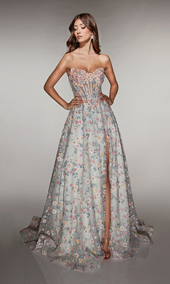 A woman in the Alyce 61986 long prom dress with a strapless neckline, 3D floral appliques, sheer bodice, high slit, and a-line skirt poses with hands on hips.