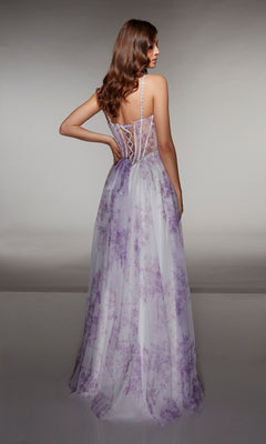 A woman faces away from the camera wearing the Alyce 61994 long prom dress, a sleeveless white gown with lavender floral patterns and a lace-up corset bodice.