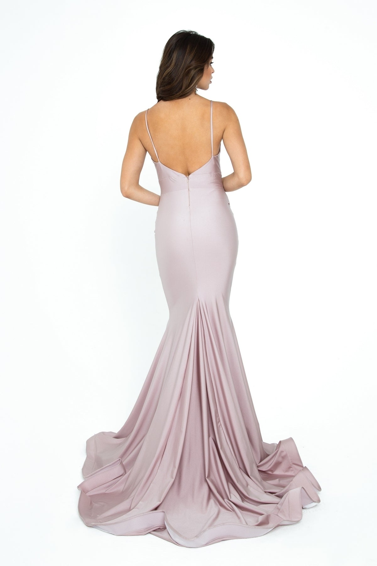 A woman models the Rushed-Sash Long Mermaid Prom Dress: Atria 6200H, a fitted, floor-length mauve gown with spaghetti straps and a low back, standing against a plain white background.