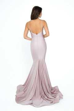 A woman models the Rushed-Sash Long Mermaid Prom Dress: Atria 6200H, a fitted, floor-length mauve gown with spaghetti straps and a low back, standing against a plain white background.