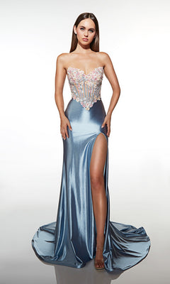 A woman poses against a plain white background in the Alyce 62012 long prom dress—a strapless, floor-length blue satin gown with a high leg slit and a fitted, floral-embellished corset.