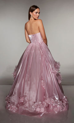 A woman stands facing away, looking over her shoulder in the Alyce 62014 Long Prom Dress—a strapless ballgown made from liquid organza with 3D floral appliques.