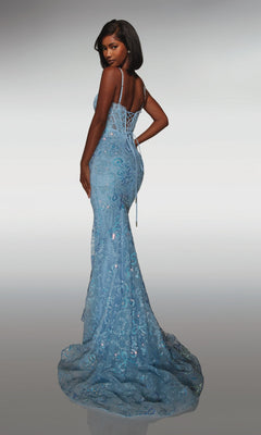 Woman wearing Alyce 62017—a long prom dress in light blue with a fitted silhouette, sequin accents, and lace-up back—stands and looks over her shoulder.