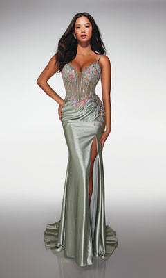 A woman models the Alyce 62022 long prom dress in celadon—a form-fitting satin gown with a corset bodice, high-leg slit, floral-embellished bodice, spaghetti straps, and a long train—set against a plain background.