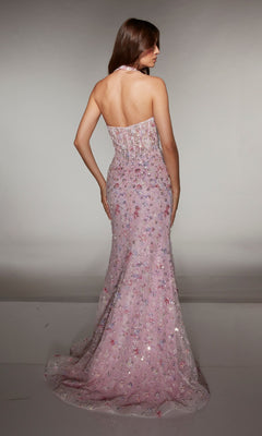 A woman faces away in the Alyce 62044, a strapless, floor-length light pink sequin prom dress with floral accents, a statement satin bow, slight train, and set against a plain gray background.