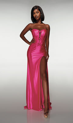A woman poses against a plain background wearing the Alyce 62046 long prom dress, featuring a strapless corset bodice, floor-length hot pink satin fabric, and a high-leg slit.