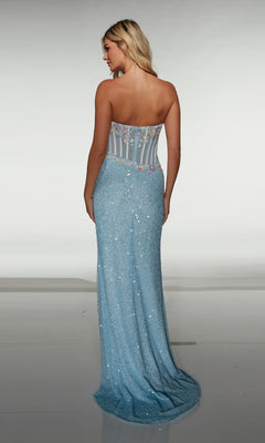 Woman facing away from the camera wearing the Alyce 62047: a strapless, floor-length blue prom dress with a fitted sheer back bodice featuring floral appliques.