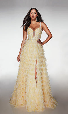 A woman models the Alyce 62052 long prom dress—a pale yellow, strapless gown with a corset bodice, deep neckline, ruffled A-line skirt, and thigh-high slit.