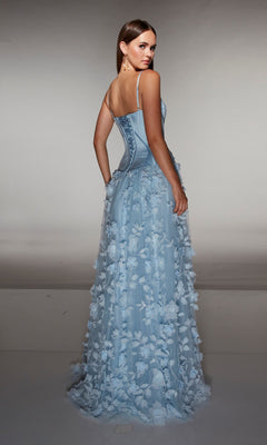 A woman faces away in a studio, wearing the Alyce 62072 long formal dress—light blue with delicate thin straps, 3D floral-lace appliques, and a corset bodice.