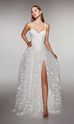 A woman wears the Alyce 62072 long formal dress in diamond white, featuring thin straps, a corset bodice, 3D floral-lace appliques on the skirt, and a high front slit, standing against a plain background.