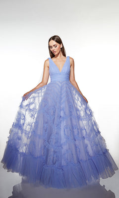 A woman wears the Alyce 62079 long prom dress in light blue, featuring tulle fabric, a deep V-neck, and a full ruffled A-line skirt, standing against a plain white background.