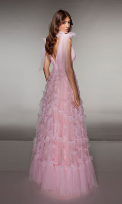 A woman in the Alyce 62079 long prom dress, featuring light pink tulle, an a-line skirt, and ruffle details, stands facing away while looking over her shoulder.