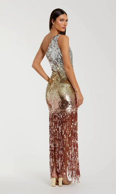 A woman in the Mac Duggal 6212 long formal dress, an ombre sequin gown with gold, silver, and rose gold gradient, one-shoulder design, and fringed hem, poses against a plain background.