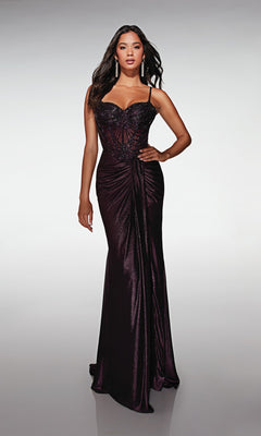A woman models the Alyce 62143 long formal dress, featuring thin straps, a beaded and embellished corset bodice, and a draped front. She stands against a plain background.