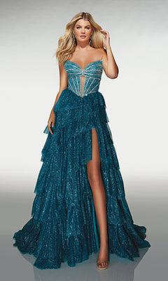 A woman models the Alyce 62144, a long formal dress with a strapless structured bodice, glittery teal fabric, tiered ruffle skirt, high slit, and nude heels—an elegant prom look against a plain background.